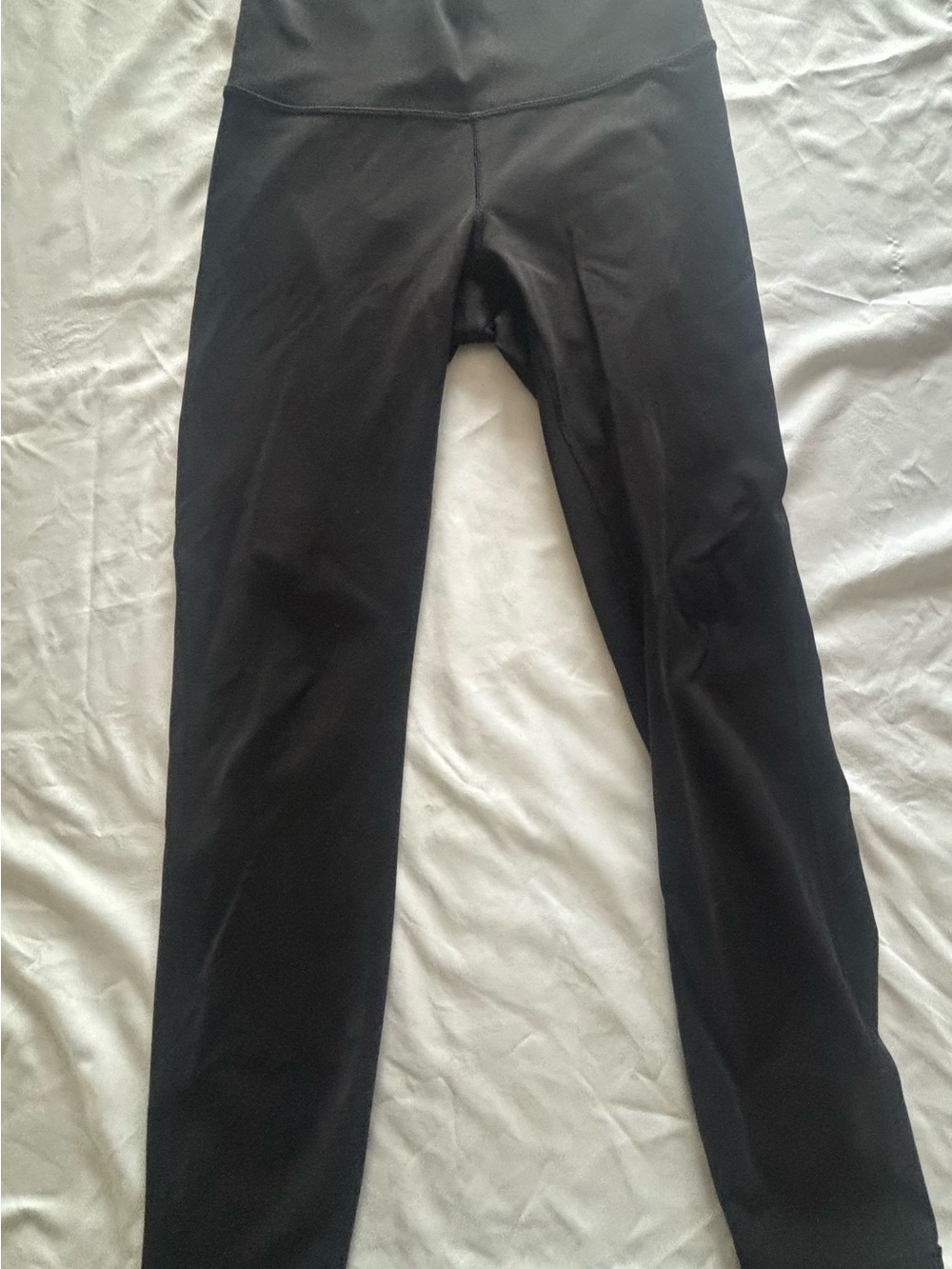 lululemon athletica Black Mid-Rise Leggings with slit up back of leg. Size 6
